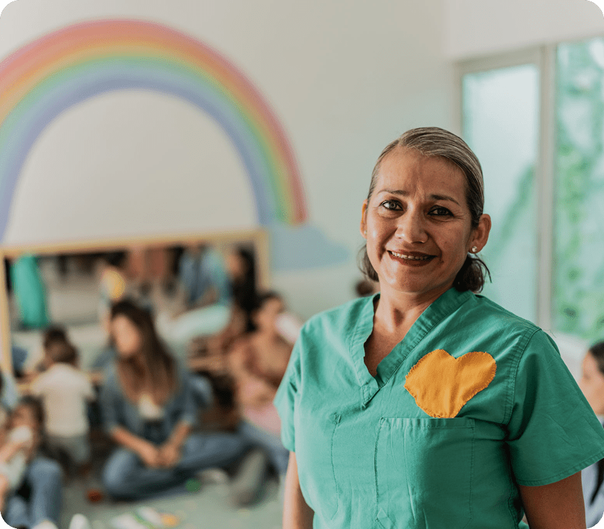 Caregiver in cheerful, child-friendly environment